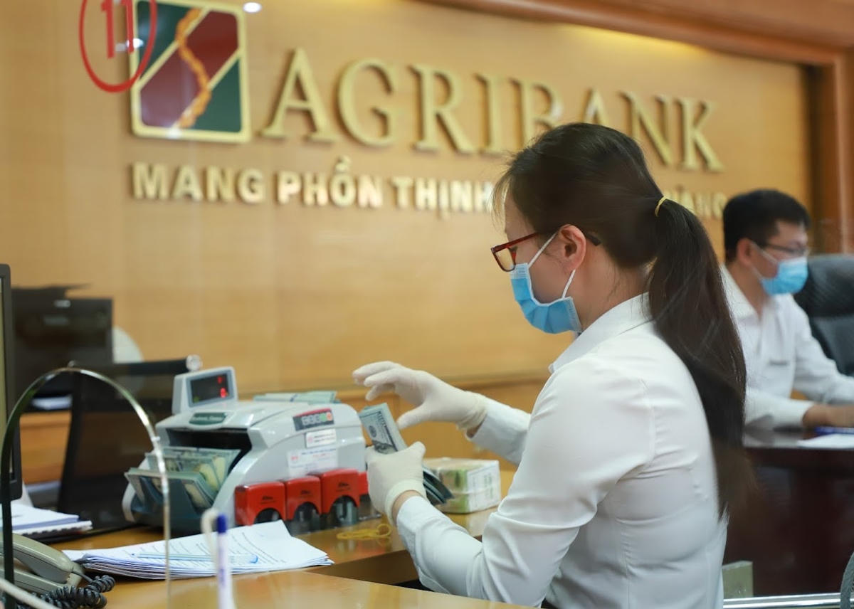 Nới biên độ điều chỉnh nhằm giúp tỷ giá ổn định. Ảnh: Quang Vinh.