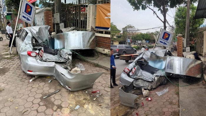 Cuộn thép từ xe container rơi xuống đã khiến chiếc ô tô con bị đè nát hoàn toàn ở Hà Nội. Ảnh: Báo SK&ĐS.