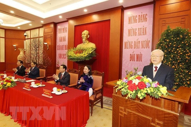 Tổng Bí thư Nguyễn Phú Trọng chúc Tết các lãnh đạo và nguyên lãnh đạo Đảng, Nhà nước. Ảnh: Trí Dũng/TTXVN.