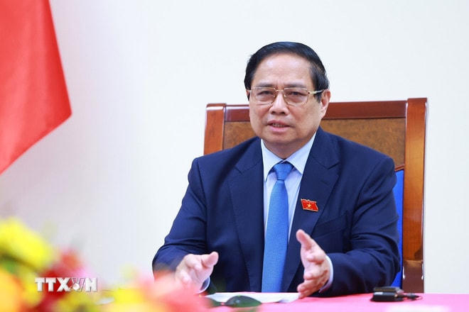 ttxvn-thu-tuong-pham-minh-chinh-dien-dam-voi-thu-tuong-singapore-2.jpg