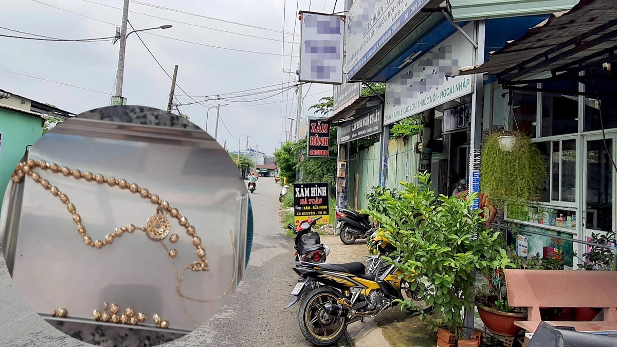 Khu vực xảy ra vụ việc và sợi dây chuyền bị đứt, rớt xuống đường (Ảnh: Hoàng Thuận).