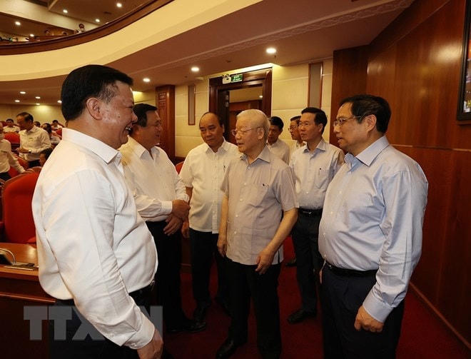 Tổng Bí thư Nguyễn Phú Trọng, Chủ tịch nước Nguyễn Xuân Phúc, Thủ tướng Phạm Minh Chính và Thường trực Ban Bí thư Võ Văn Thưởng cùng các đại biểu dự hội nghị. (Ảnh: Trí Dũng/TTXVN).