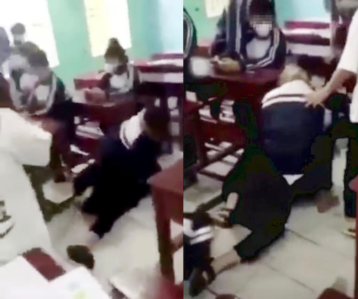 Nữ sinh lớp 10 bị nhóm bạn túm tóc, đánh vào mặt và đầu. (Ảnh cắt từ clip).