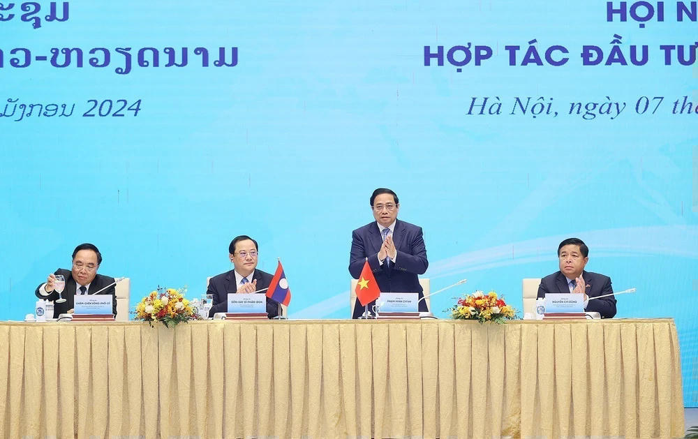 ttxvn-thu-tuong-pham-minh-chinh-va-thu-tuong-lao-sonexay-siphandone-du-hoi-nghi-hop-tac-dau-tu-viet-nam-lao-2-1524.jpg