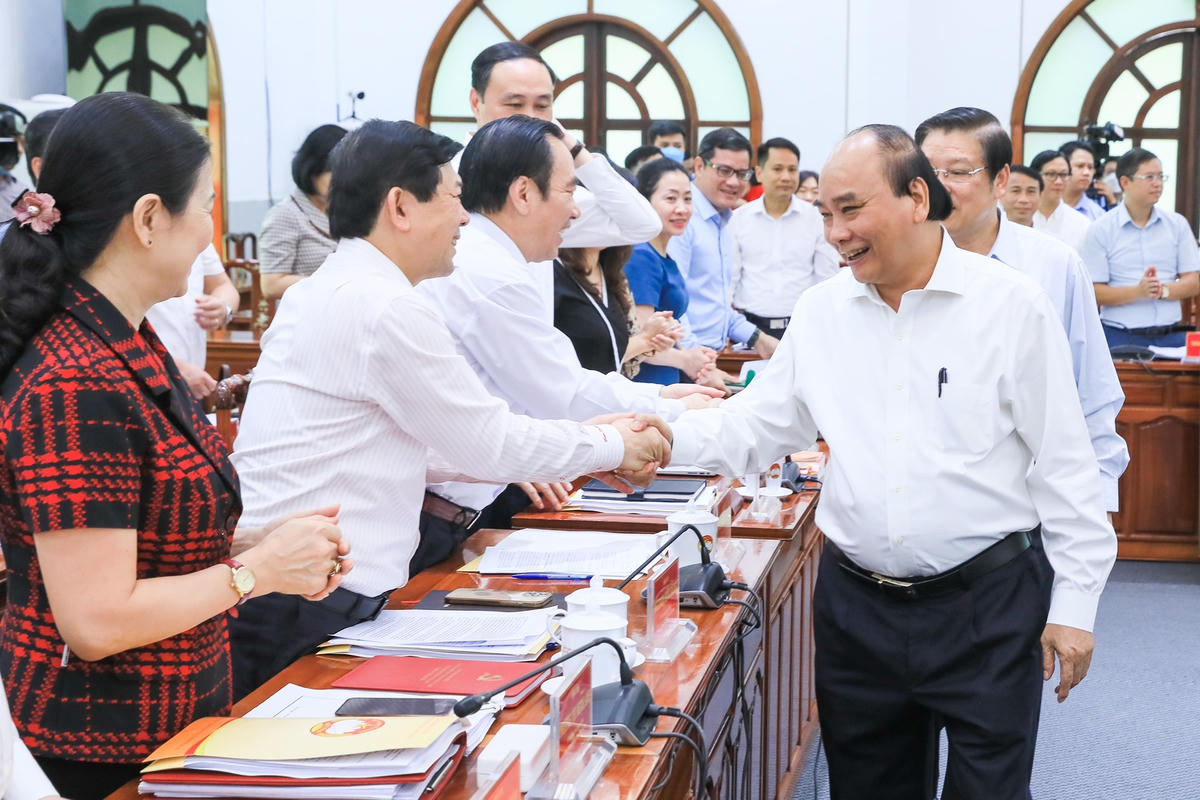 Chủ tịch nước Nguyễn Xuân Phúc tham dự buổi làm việc với Đảng đoàn MTTQ Việt Nam. Ảnh: Quang Vinh.