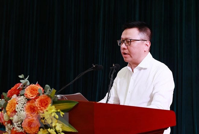 Chủ tịch Hội Nhà báo Việt Nam Lê Quốc Minh báo cáo kết quả và nhiệm vụ trọng tâm của Hội Nhà báo. (Ảnh: Dương Giang/TTXVN).