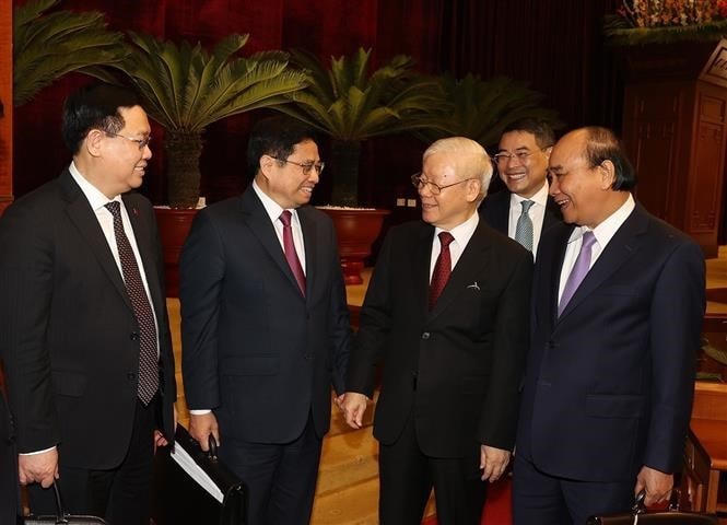 Tổng Bí thư Nguyễn Phú Trọng, Chủ tịch nước Nguyễn Xuân Phúc, Thủ tướng Phạm Minh Chính và Chủ tịch Quốc hội Vương Đình Huệ dự bế mạc hội nghị. (Ảnh: Trí Dũng/TTXVN).