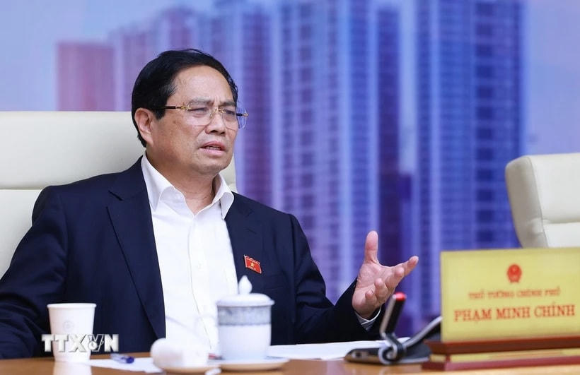 Thủ tướng Phạm Minh Chính chủ trì cuộc làm việc của Thường trực Chính phủ về tình hình thị trường bất động sản. (Ảnh: Dương Giang/TTXVN)