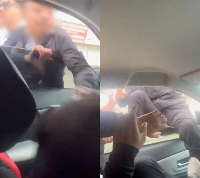 Nhóm người của Tuân tấn công anh Thuận khi đang ngồi trong xe. Ảnh cắt từ Clip.