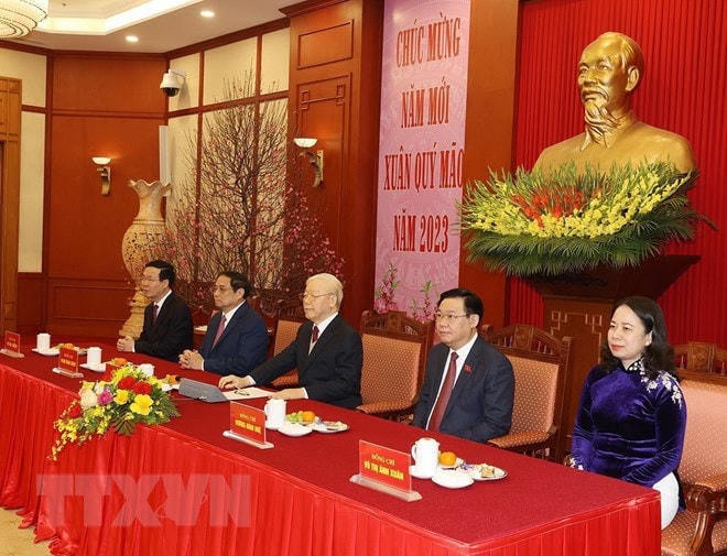 Tổng Bí thư Nguyễn Phú Trọng cùng các lãnh đạo Đảng, Nhà nước dự chúc Tết. Ảnh: Trí Dũng/TTXVN.