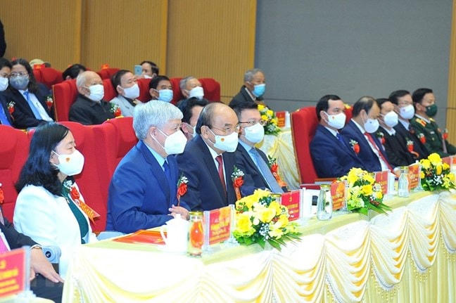 Chủ tịch nước Nguyễn Xuân Phúc, Chủ tịch UBTƯ MTTQ Việt Nam Đỗ Văn Chiến và các đại biểu dự lễ kỷ niệm. Ảnh: Minh Đức/TTXVN.