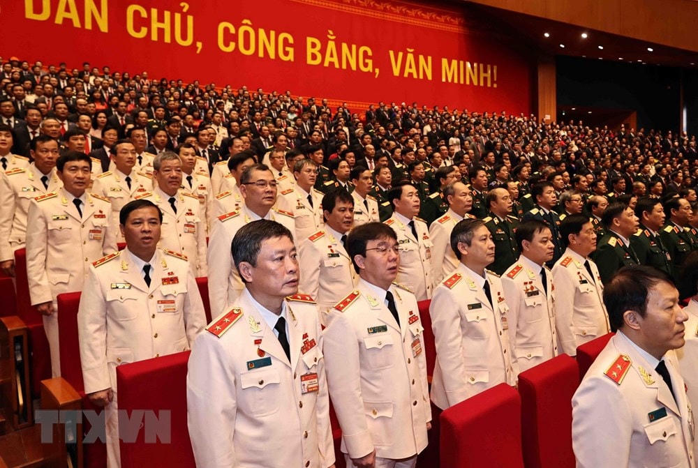 Đoàn đại biểu Đảng bộ Công an Trung ương và Đảng bộ Quân đội dự phiên khai mạc Đại hội. Ảnh: TTXVN.  