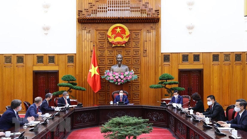 Thủ tướng Phạm Minh Chính làm việc với Chủ tịch Hội nghị Liên hợp quốc về Biến đổi khí hậu lần thứ 26. (Ảnh: Dương Giang/TTXVN).