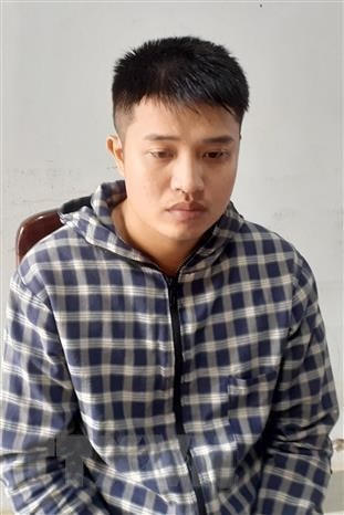 Đối tượng Phạm Đức Điệp tại cơ quan điều tra. (Ảnh: Thanh Tân/TTXVN).