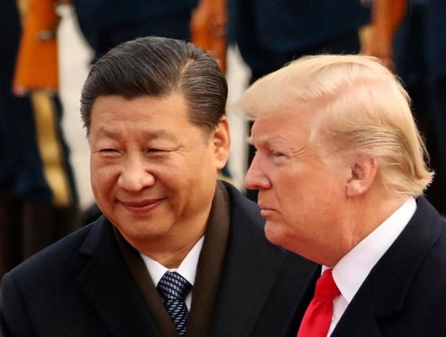 Tổng thống Mỹ Donald Trump (phải) và Chủ tịch Trung Quốc Tập Cận Bình. (Ảnh: Reuters).