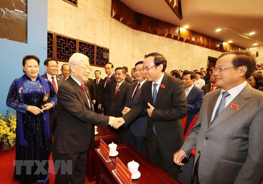 Tổng Bí thư, Chủ tịch nước Nguyễn Phú Trọng và Chủ tịch Quốc hội Nguyễn Thị Kim Ngân với các đại biểu dự Đại hội. (Ảnh: Trí Dũng/TTXVN).