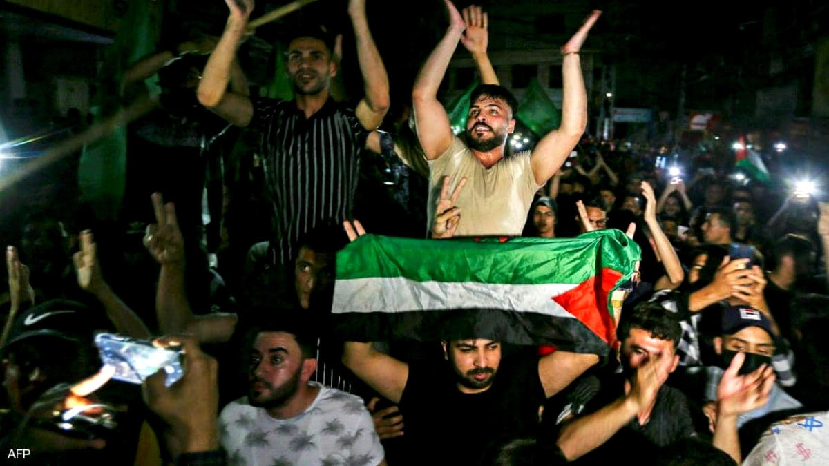 Người dân Gaza đổ ra đường ăn mừng ngay khi lệnh ngừng bắn có hiệu lực. Ảnh: Ảnh: AFP.