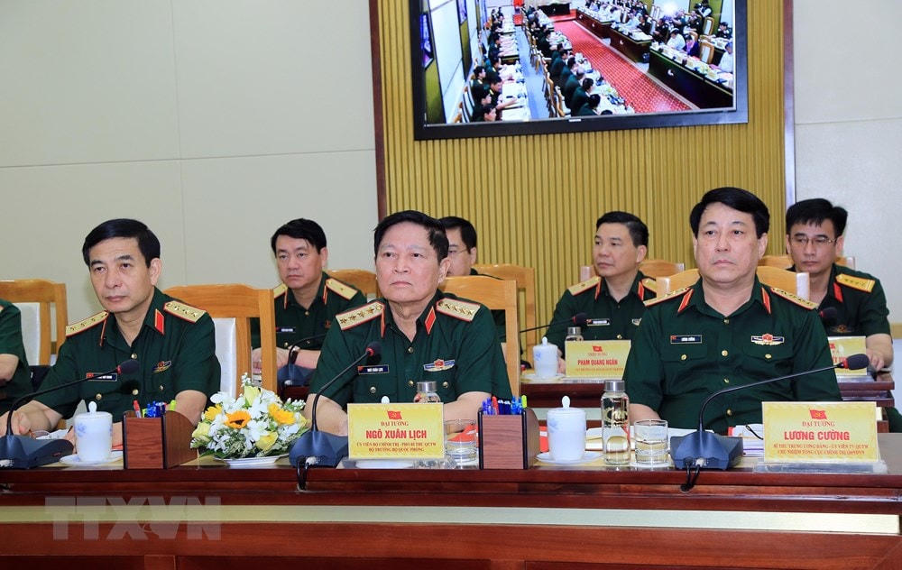 Đại tướng Ngô Xuân Lịch, Ủy viên Bộ Chính trị, Phó Bí thư Quân ủy Trung ương, Bộ trưởng Bộ Quốc phòng (giữa) chủ trì Hội nghị. Ảnh: TTXVN.