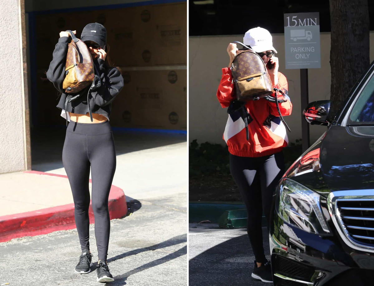 Kourtney Kardashian có thói quen trốn sau chiếc ba lô Louis Vuitton của mình mỗi khi phát hiện ra các tay săn ảnh.  