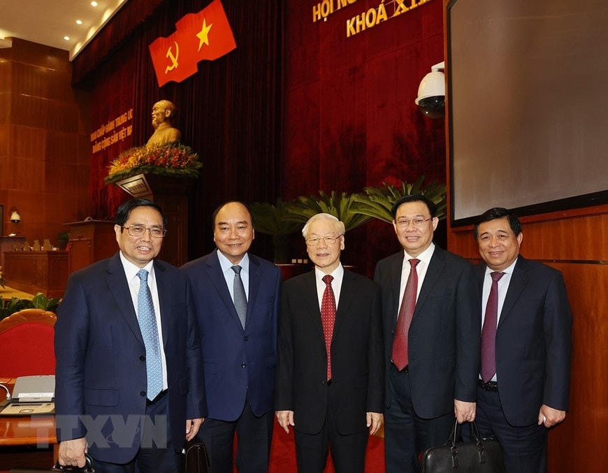 Tổng Bí thư Nguyễn Phú Trọng, Chủ tịch nước Nguyễn Xuân Phúc, Thủ tướng Chính phủ Phạm Minh Chính, Chủ tịch Quốc hội Vương Đình Huệ dự bế mạc Hội nghị Ban Chấp hành Trung ương Đảng Cộng sản Việt Nam khóa XIII. (Ảnh: Trí Dũng/TTXVN).