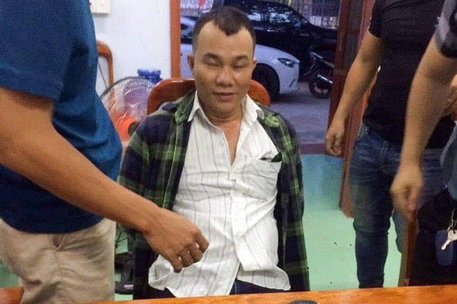 Cao Hồng Quang tại cơ quan công an. Ảnh: Q.T.
