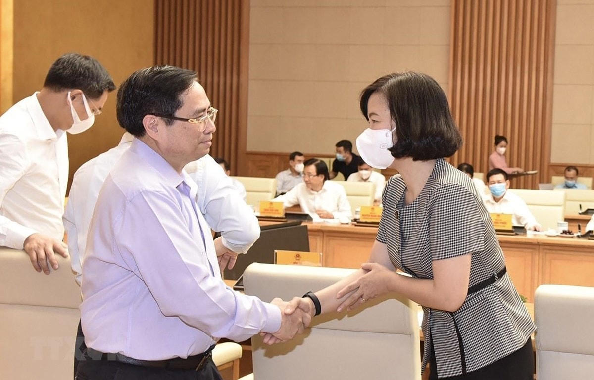 Thủ tướng Phạm Minh Chính và bà Vũ Việt Trang, Phó Tổng Giám đốc TTXVN. (Ảnh: TTXVN).