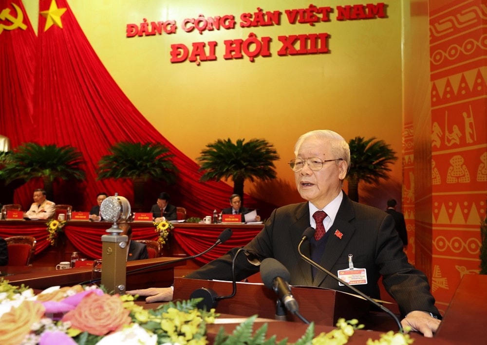 Tổng Bí thư Ban Chấp hành Trung ương Đảng, Chủ tịch nước CHXHCN Việt Nam Nguyễn Phú Trọng đọc Báo cáo chính trị của Ban Chấp hành Trung ương Đảng khóa XII và các văn kiện trình Đại hội. Ảnh: TTXVN.  