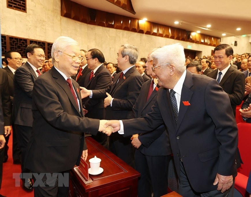Tổng Bí thư, Chủ tịch nước Nguyễn Phú Trọng và Chủ tịch Quốc hội Nguyễn Thị Kim Ngân với các đại biểu dự Đại hội. (Ảnh: Trí Dũng/TTXVN).