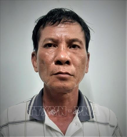 Nghi phạm Nguyễn Hòa (59 tuổi) bị bắt giữ. Ảnh: TTXVN.