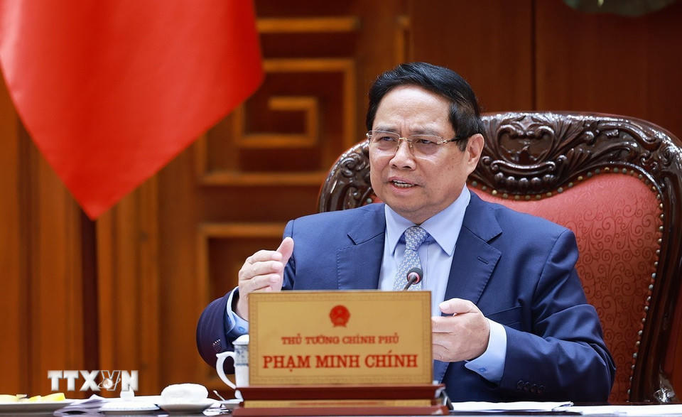 Thủ tướng Phạm Minh Chính chủ trì cuộc họp về triển khai đẩy nhanh tiến độ thực hiện các dự án đường sắt kết nối Việt-Trung. (Ảnh: Dương Giang/TTXVN)
