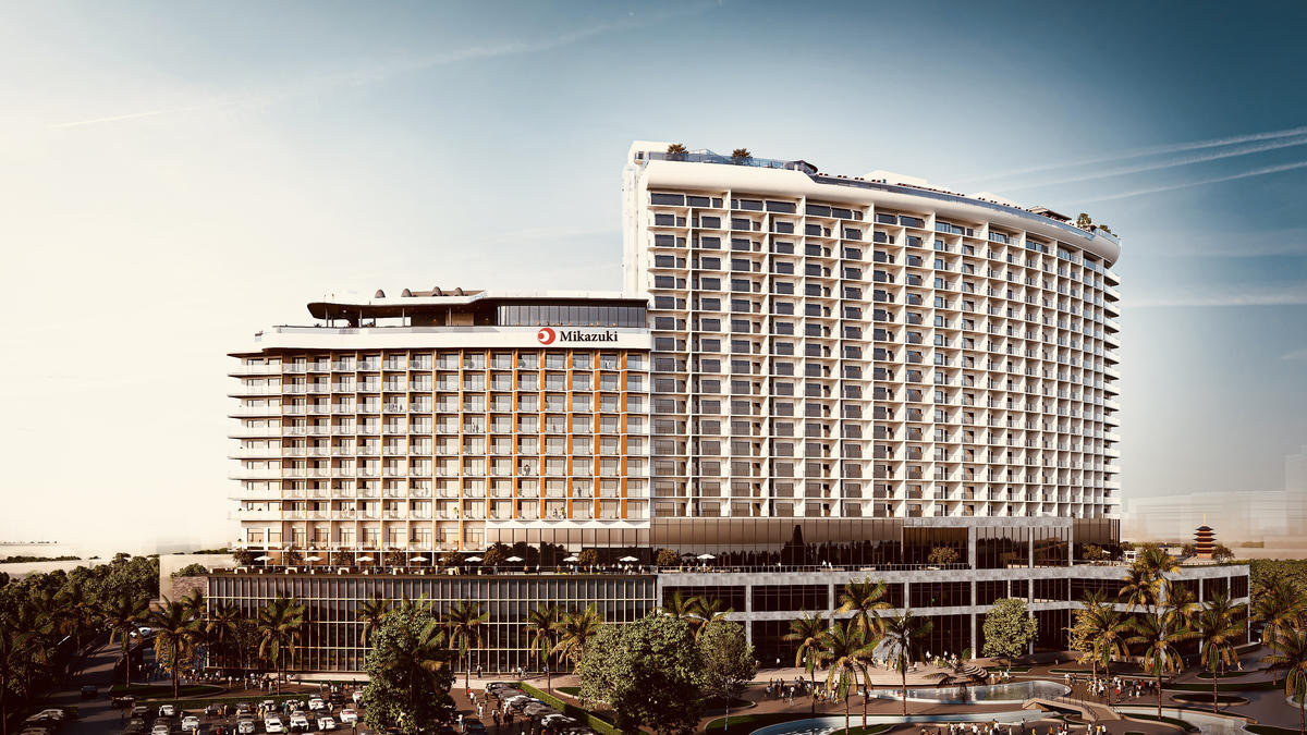 Khách sạn giai đoạn 1 cao 22 tầng (bên phải) và phối cảnh khách sạn giai đoạn 2 cao 15 tầng (bên trái). Ảnh: Nguyễn Duyên.