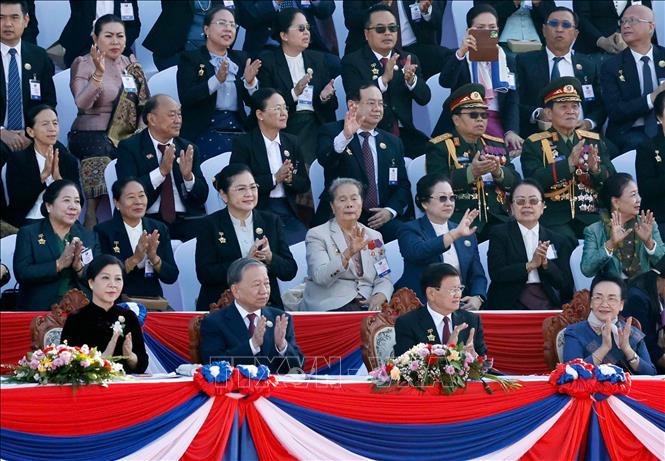 Tổng Bí thư Tô Lâm và Phu nhân cùng các đại biểu dự Lễ kỷ niệm 50 năm Quốc khánh Lào và 105 năm Ngày sinh Chủ tịch Kaysone Phomvihane. Ảnh: Thống Nhất/TTXVN