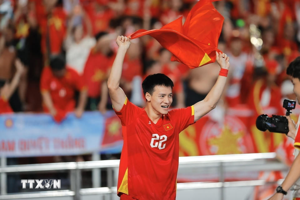 Thanh Nhàn hân hoan trong niềm vui chiến thắng. (Ảnh: Minh Quyết/TTXVN).