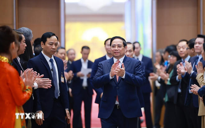 Thủ tướng Phạm Minh Chính đến dự Hội nghị công bố thành lập Trung tâm Tài chính quốc tế tại Việt Nam. (Ảnh: Dương Giang/TTXVN).