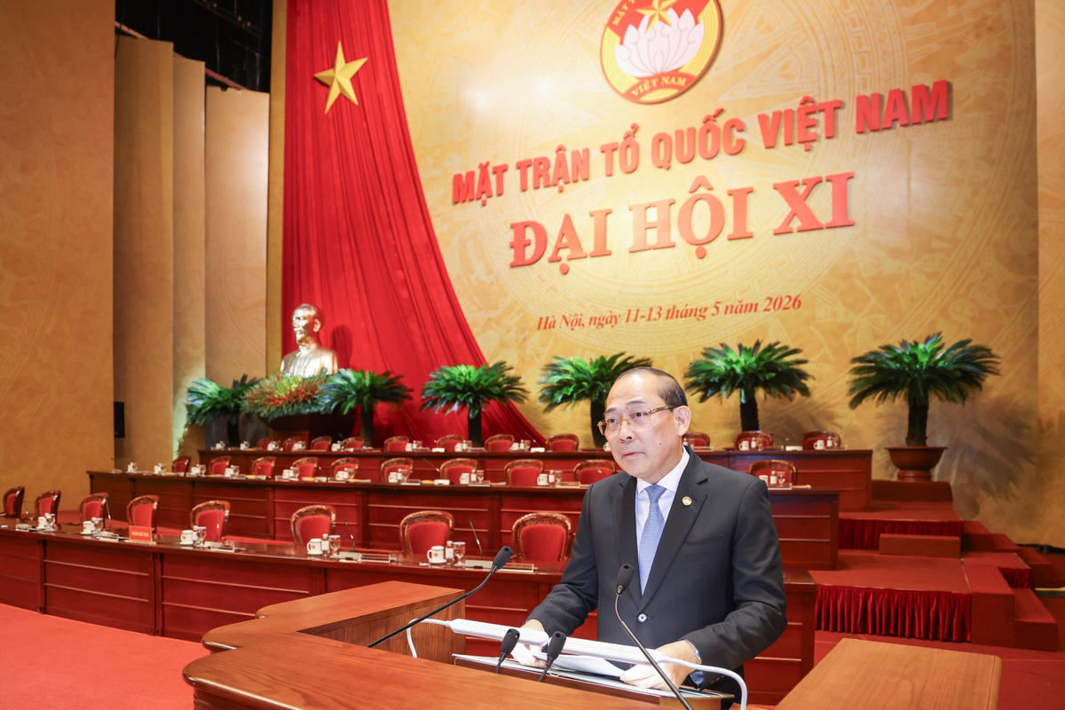 Phó Chủ tịch Hoàng Công Thủy trình bày Tờ trình sửa đổi, bổ sung Điều lệ MTTQ Việt Nam tại Đại hội. Ảnh: Quang Vinh.