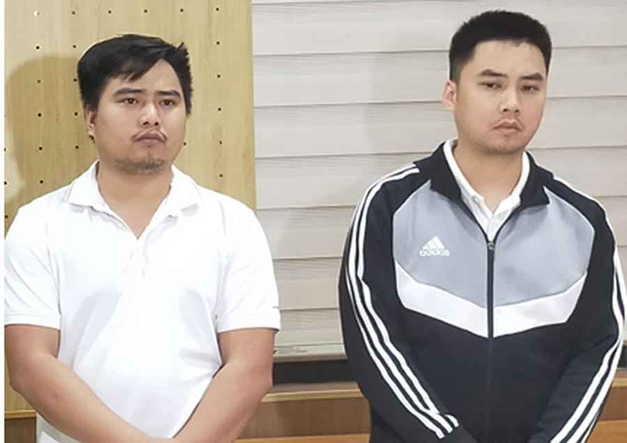 Đào Văn Minh và Đào Văn Cảnh tại cơ quan điều tra. Ảnh: CATH