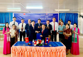 Ký kết hợp tác thúc đẩy hữu nghị, đoàn kết giữa Việt Nam - Lào