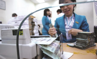 Áp lực mất giá đồng VND giảm bớt, lãi suất kỳ vọng sẽ hạ nhiệt thời gian tới