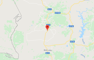 Bình Phước: Vào cua gấp, xe container bị lật chắn ngang Quốc lộ 13