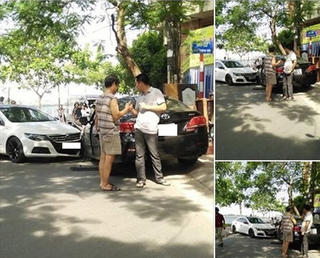 Sau va chạm xe, hai tài xế vui vẻ bắt tay, phân làn đường