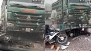 Xe tải vượt ẩu cuốn xe máy vào gầm, 2 người nguy kịch