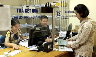 Quản lý DN không hưởng lương có phải đóng BHXH bắt buộc không?