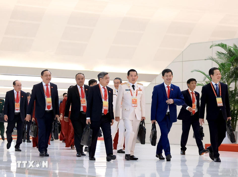 Các đại biểu đến dự phiên khai mạc Đại hội XIV của Đảng. (Ảnh: TTXVN)
